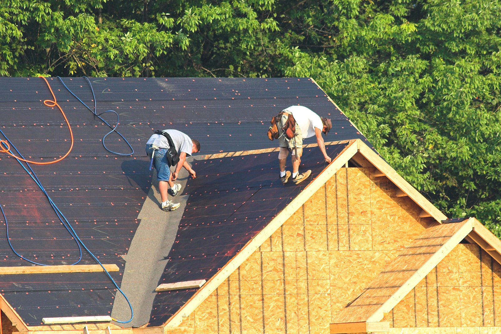 Roofers installing a new asphalt roof Columbia MD