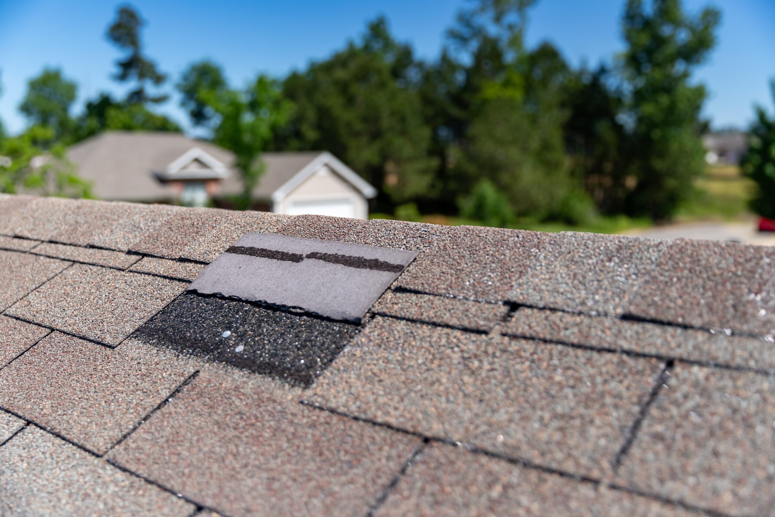 home roof missing a shingle and in need of a repair